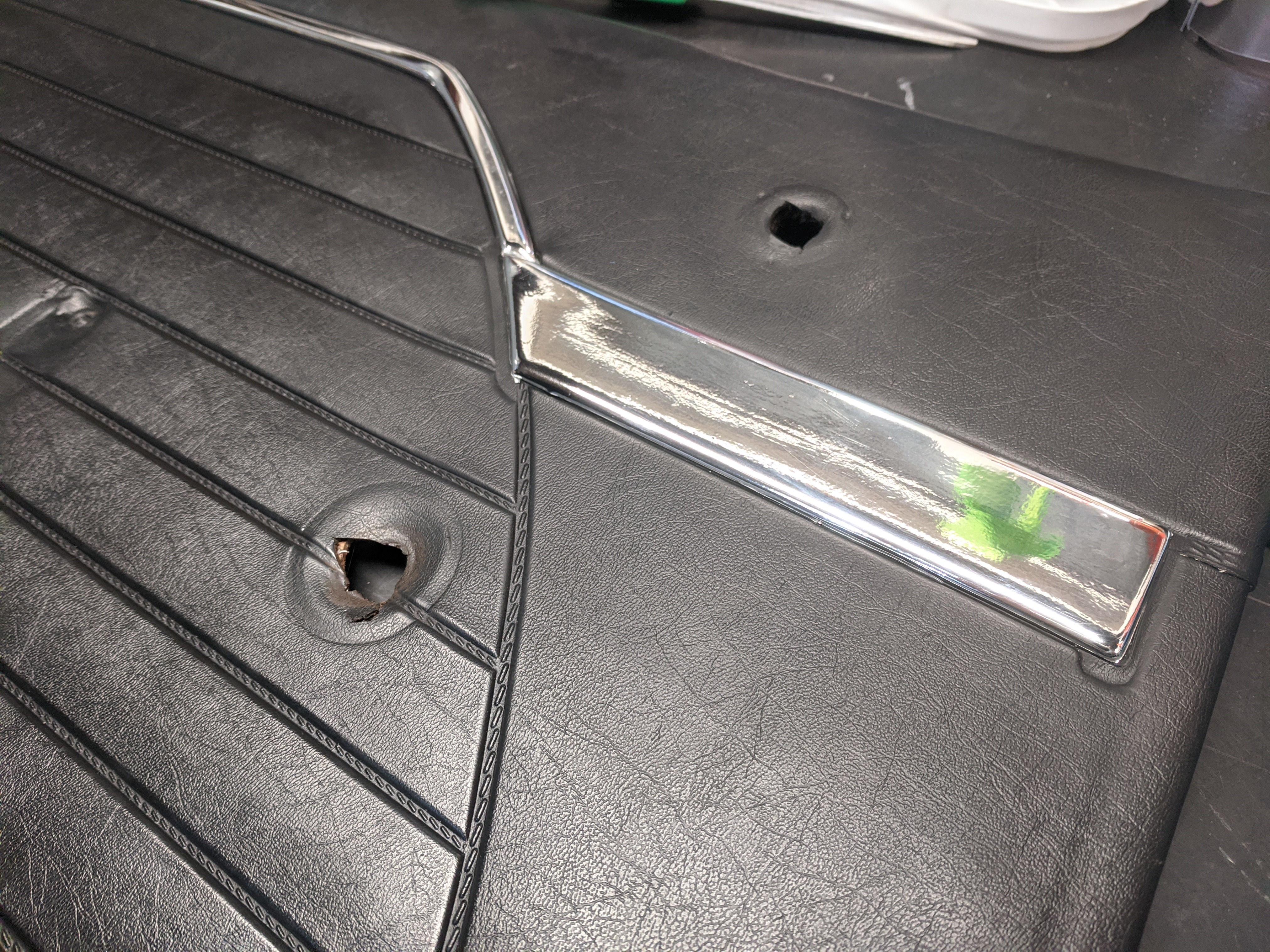 Refinished door card chrome.