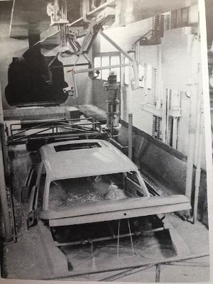 Figure 2 Neue Klasse BMW of the late Sixties taking a dip in the EPD primer bath. Photo: Schrader ( “ A History”