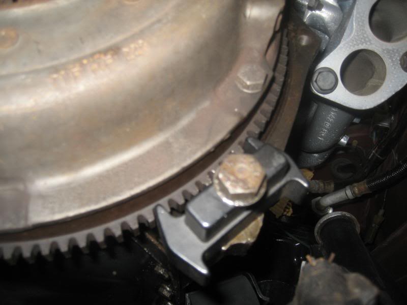 How to hold flywheel in place while tightening? ﻿ BMW 2002 and other '02
