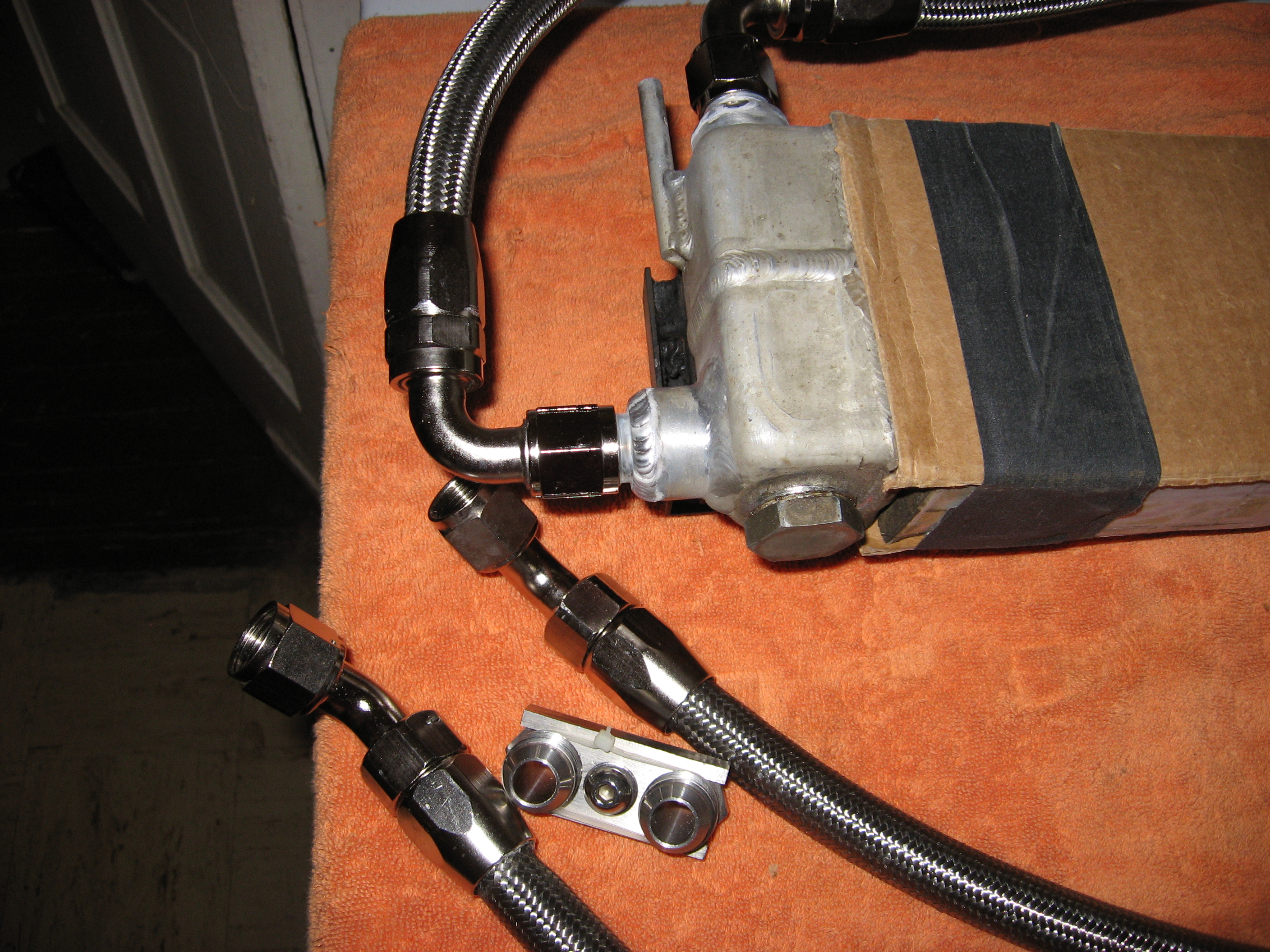 thumbnail interactive-video image 1 of Rx7 FC 86-91 Oil Cooler Lines – Steel Braided W/ AN Fittings – Stu Kelly Motorsports 1 of 4