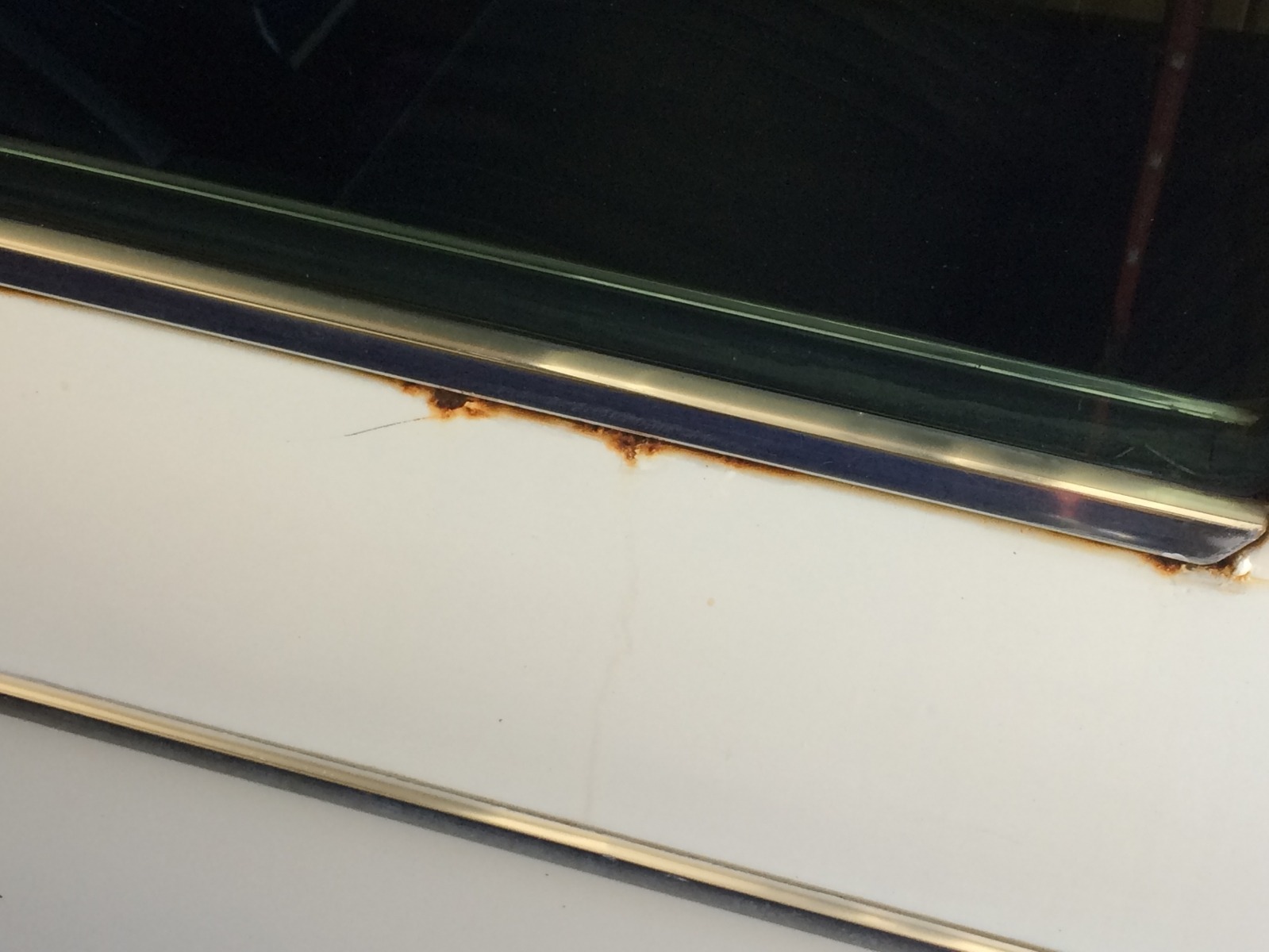 Rust below side window drivers side back seat - Member's Albums - 2002FAQ