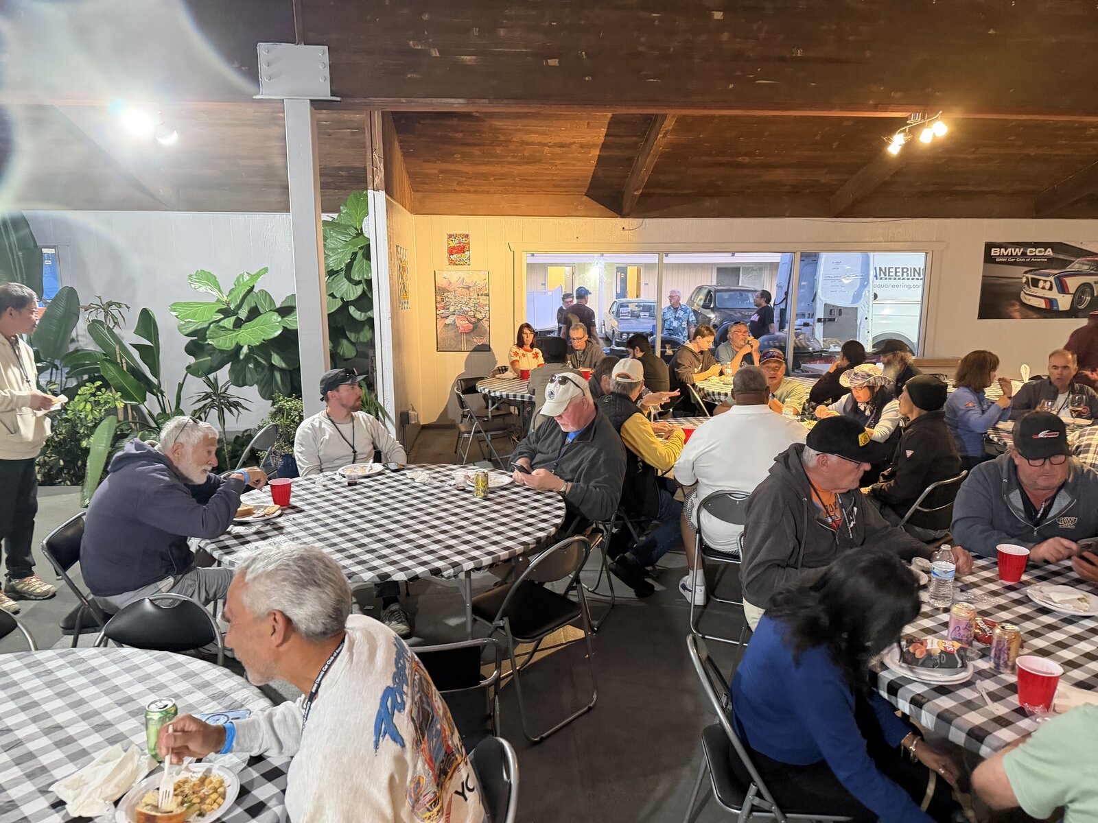 The gathering room filled with people sharing dinner and conversation
